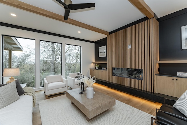 4163 Christopherson Ln SW, Rochester, MN 55902 - living area with beam ceiling, ceiling fan, light wood-style flooring, recessed lighting, and a glass covered fireplace