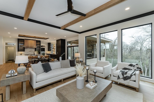 4163 Christopherson Ln SW, Rochester, MN 55902 - living area featuring beamed ceiling, ceiling fan, plenty of natural light, light wood-style flooring, and recessed lighting
