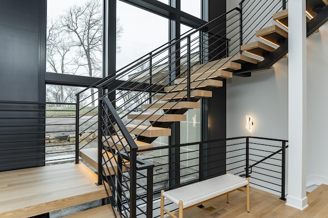 4163 Christopherson Ln SW, Rochester, MN 55902 - stairs featuring wood finished floors and baseboards