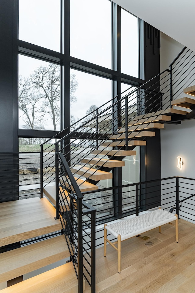 4163 Christopherson Ln SW, Rochester, MN 55902 - stairs with wood finished floors and healthy amount of natural light