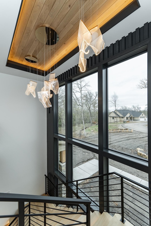 4163 Christopherson Ln SW, Rochester, MN 55902 - stairs featuring a chandelier and wood ceiling