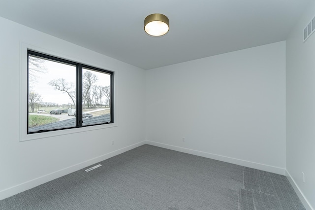 4163 Christopherson Ln SW, Rochester, MN 55902 - empty room featuring baseboards, dark colored carpet, and visible vents
