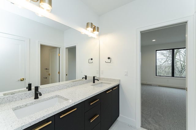 4163 Christopherson Ln SW, Rochester, MN 55902 - full bath featuring baseboards and double vanity