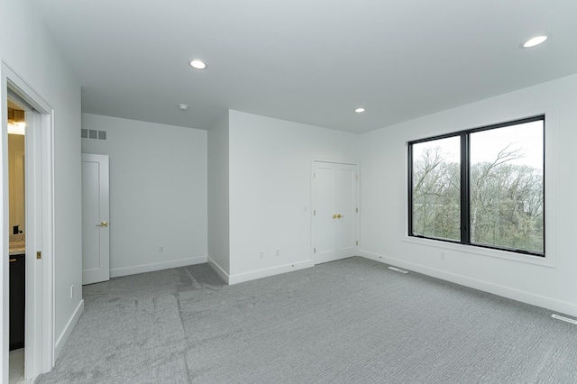 4163 Christopherson Ln SW, Rochester, MN 55902 - empty room featuring light colored carpet, baseboards, and recessed lighting