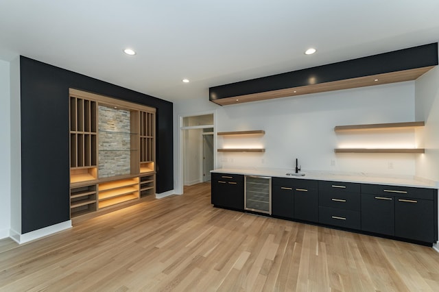 4163 Christopherson Ln SW, Rochester, MN 55902 - bar with wine cooler, a sink, light wood finished floors, recessed lighting, and baseboards