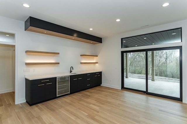 4163 Christopherson Ln SW, Rochester, MN 55902 - indoor wet bar with beverage cooler, baseboards, recessed lighting, and light wood-type flooring
