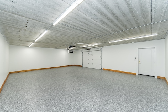4163 Christopherson Ln SW, Rochester, MN 55902 - garage featuring baseboards