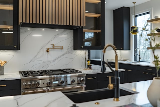 4163 Christopherson Ln SW, Rochester, MN 55902 - kitchen with stainless steel stove, dark cabinetry, and decorative backsplash