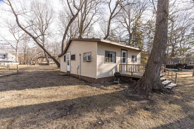 back of property with a wooden deck