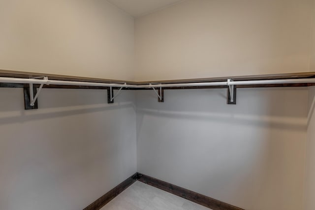 spacious closet featuring light tile flooring