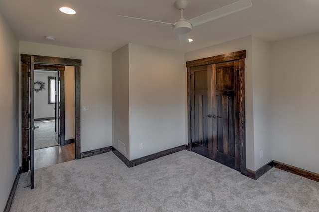 unfurnished bedroom featuring ceiling fan and light hardwood / wood-style flooring