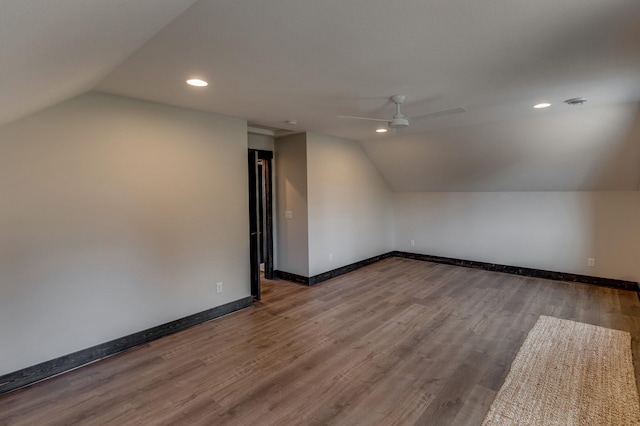 bonus room with ceiling fan, lofted ceiling, and wood-type flooring