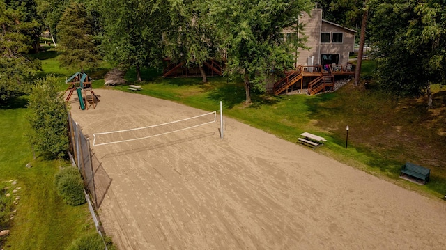 view of nearby features featuring a wooden deck, a playground, and a yard