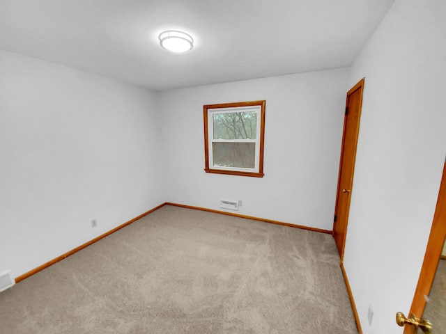 empty room with light colored carpet