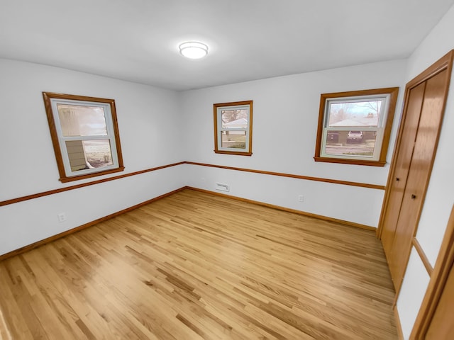 unfurnished bedroom with light hardwood / wood-style floors