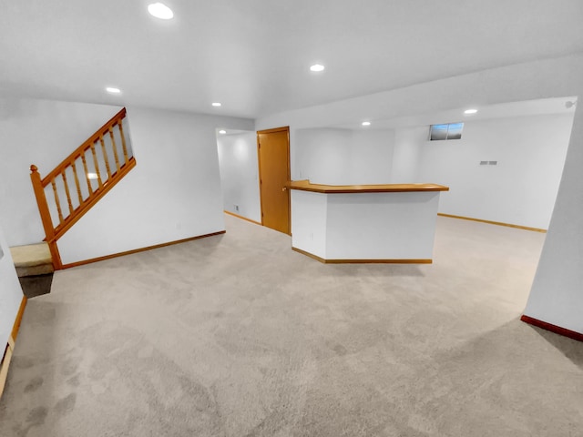 interior space featuring light colored carpet