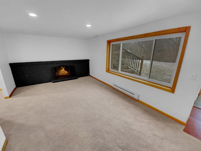 unfurnished living room with carpet floors and baseboard heating