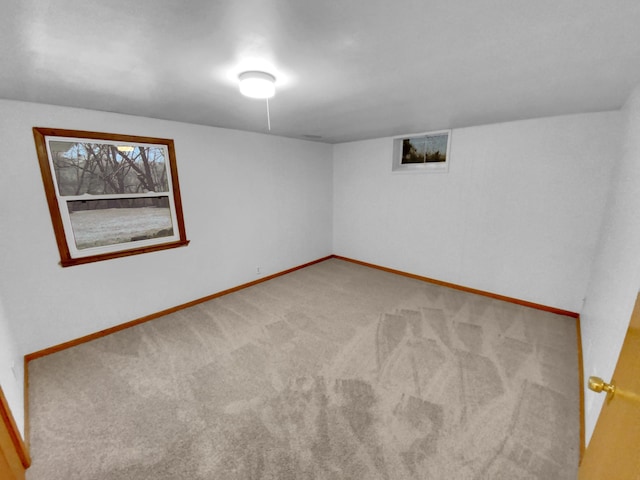 unfurnished room with carpet flooring