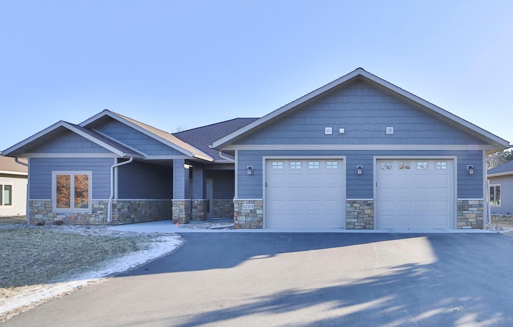 craftsman-style house featuring a garage