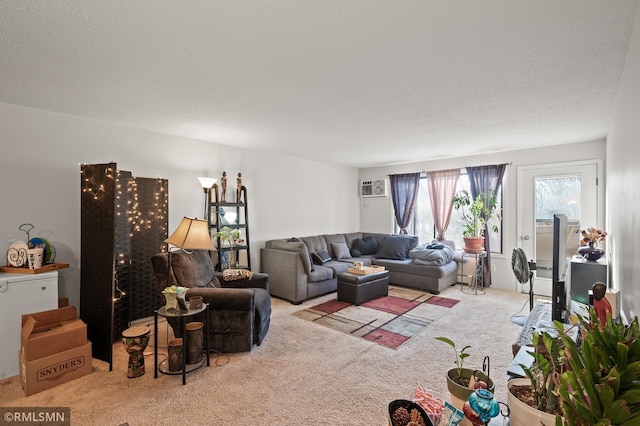 living room with light carpet, a textured ceiling, and a wall unit AC