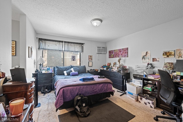 bedroom featuring light colored carpet, a wall mounted air conditioner, and a textured ceiling