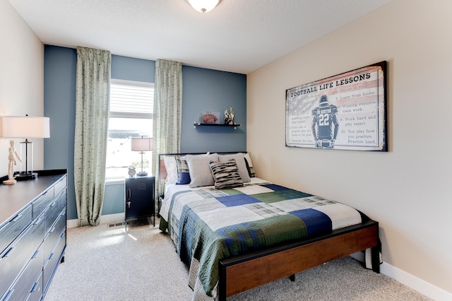 bedroom featuring light colored carpet