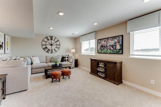 living room with light colored carpet and a textured ceiling