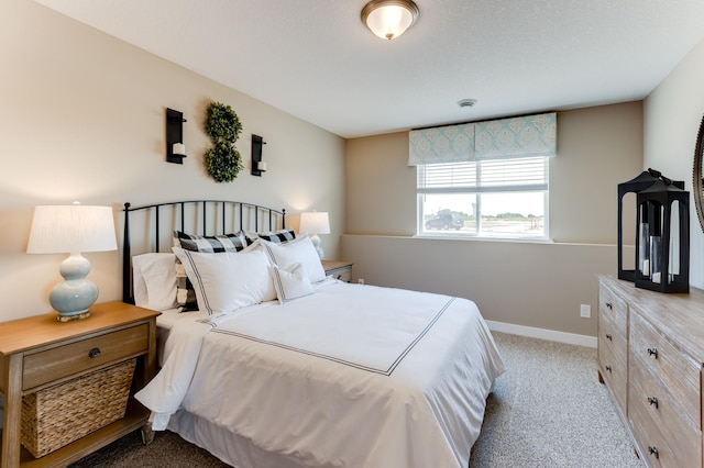 bedroom featuring light carpet