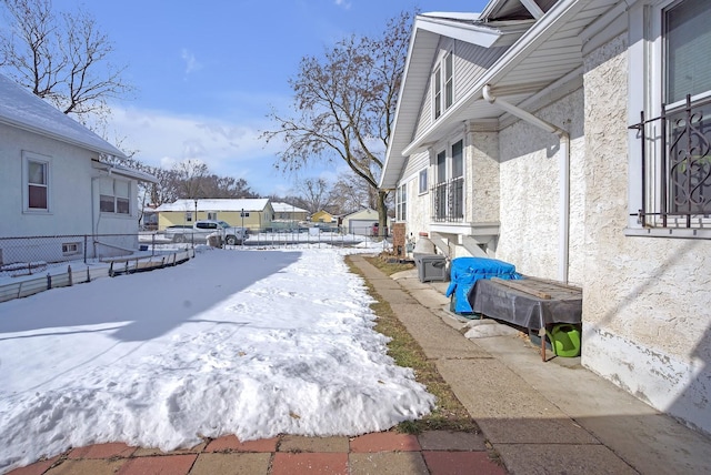 view of yard layered in snow