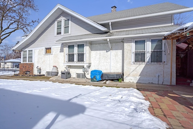 view of snow covered house