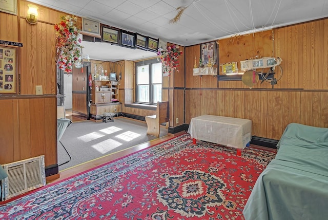 living room featuring wooden walls