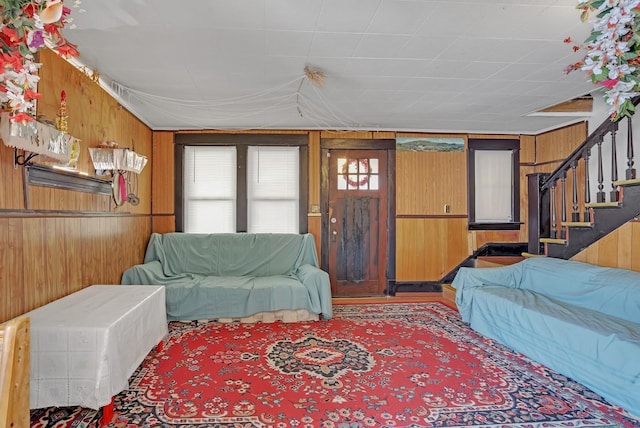 living room with wood walls