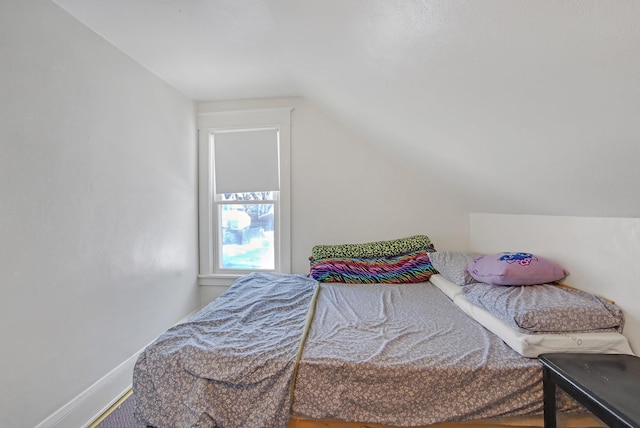 bedroom with lofted ceiling