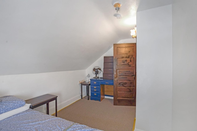 bedroom featuring lofted ceiling and carpet floors