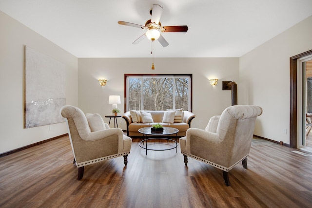 living room with hardwood / wood-style floors and ceiling fan