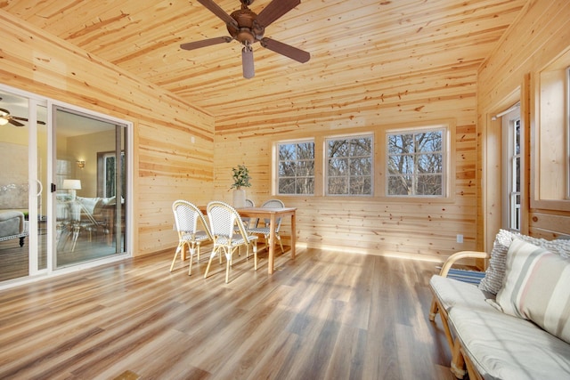 unfurnished sunroom with ceiling fan and wooden ceiling