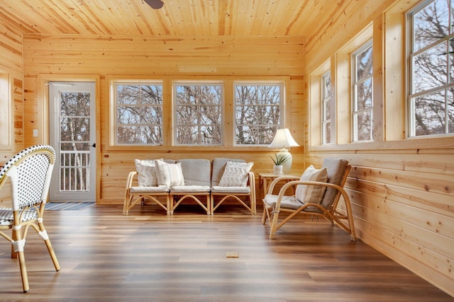 sunroom / solarium featuring wood ceiling