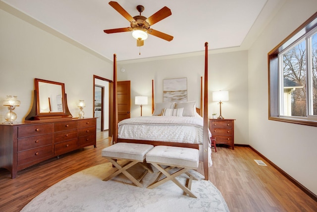 bedroom with ceiling fan, crown molding, and hardwood / wood-style flooring