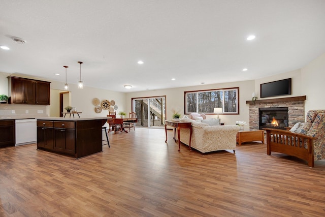 living room featuring a fireplace and light hardwood / wood-style floors