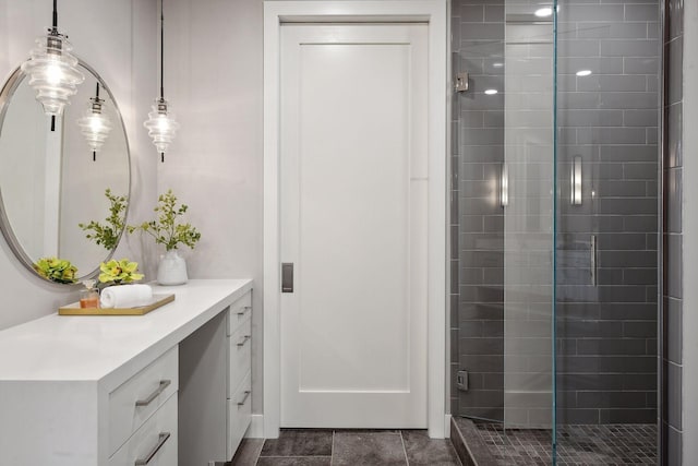 bathroom with vanity and a shower with shower door