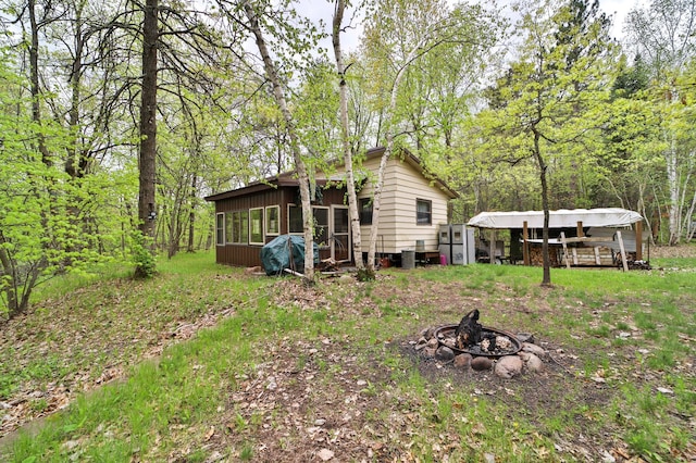 exterior space featuring an outdoor fire pit