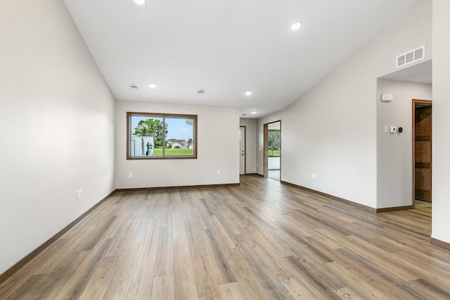 empty room featuring plenty of natural light and light wood-type flooring