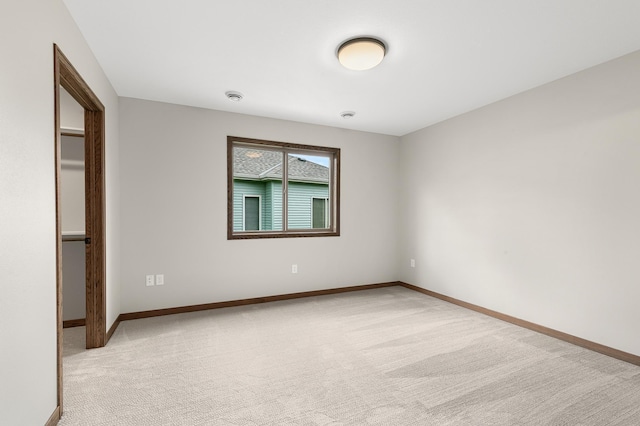 unfurnished bedroom featuring light colored carpet