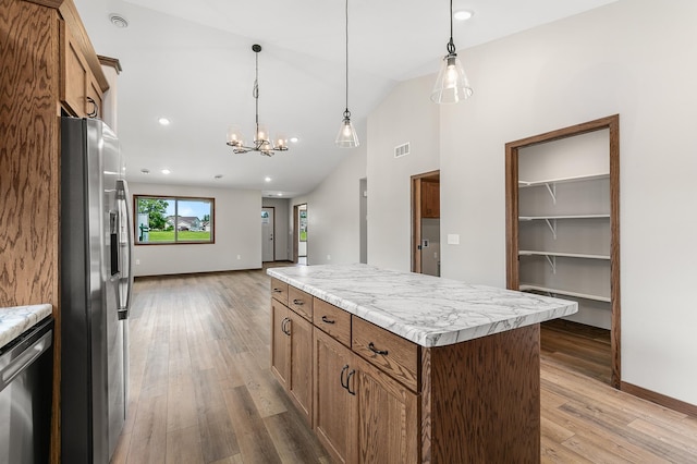 kitchen with appliances with stainless steel finishes, high vaulted ceiling, decorative light fixtures, wood-type flooring, and a center island