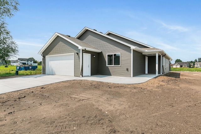 single story home featuring a garage