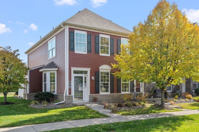 view of front facade featuring a front yard