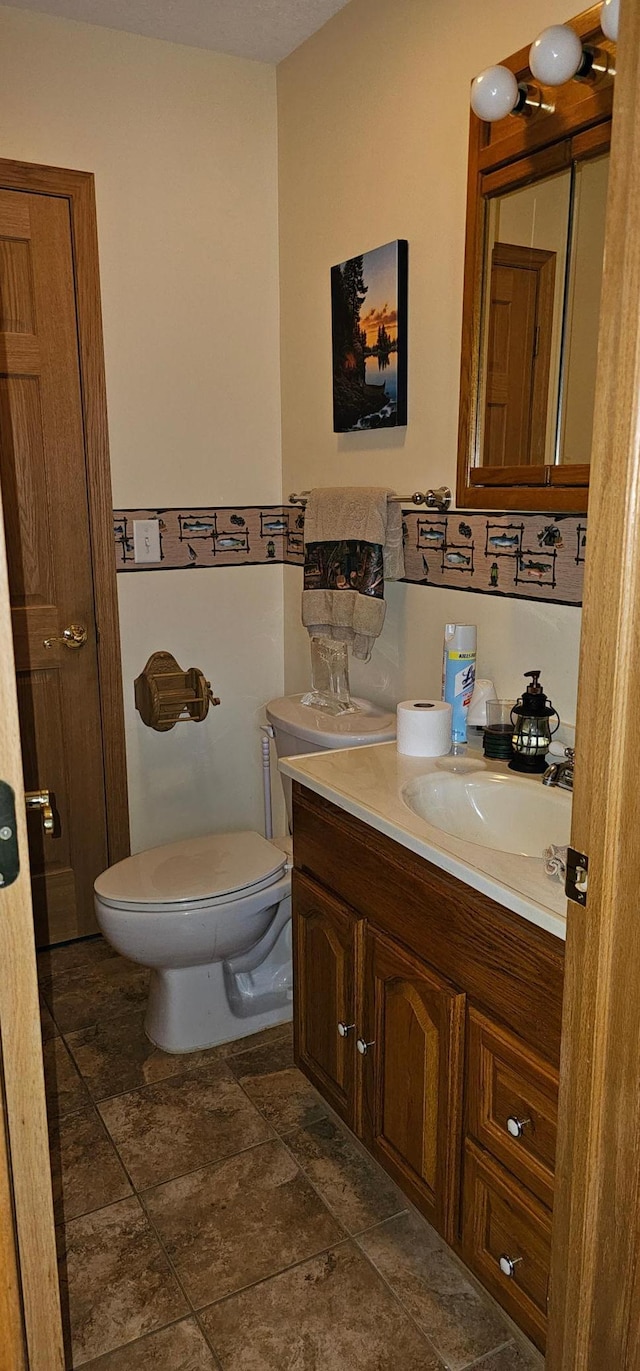 bathroom with vanity and toilet