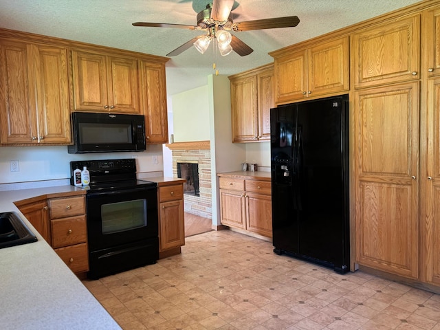 kitchen featuring black appliances, brown cabinetry, light countertops, and light floors