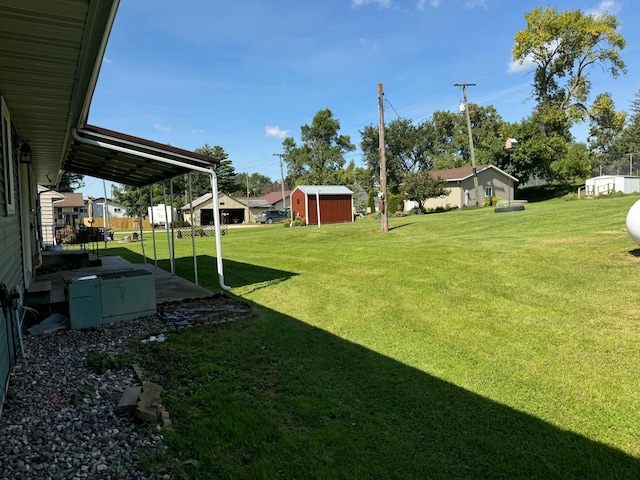 view of yard featuring a storage shed and an outbuilding