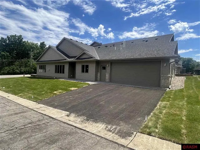 ranch-style home featuring a garage and a front yard